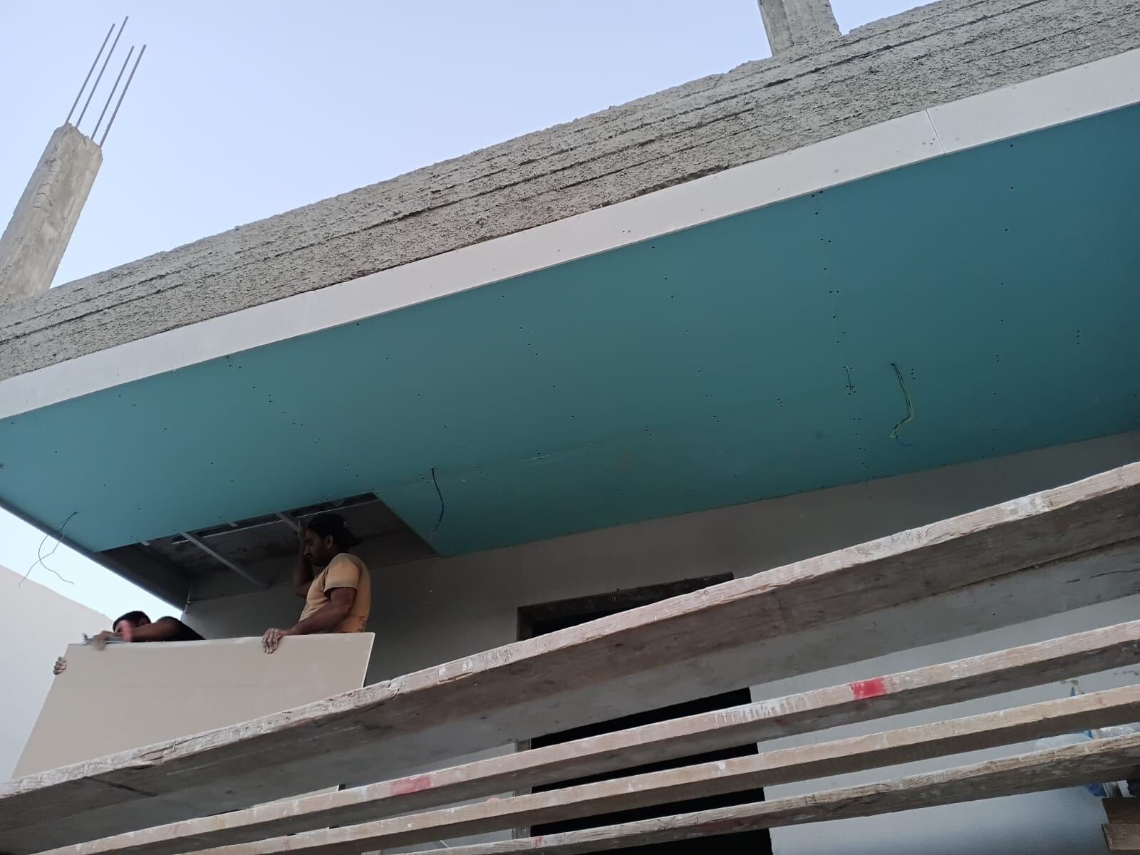Exterior balcony ceiling installation in progress