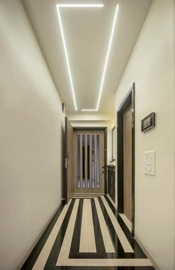 Hallway with gypsum partition and patterned flooring
