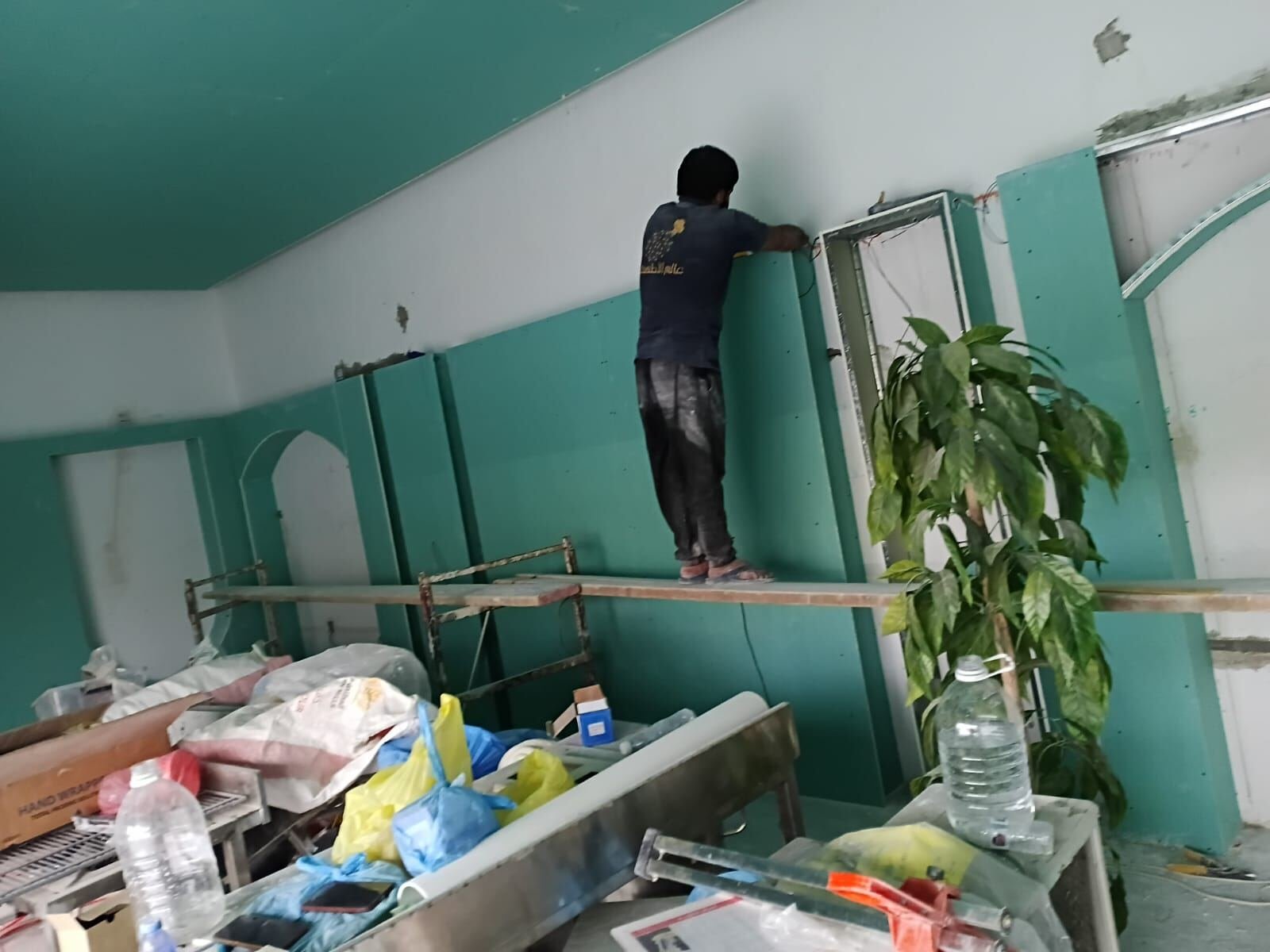 Our team finishing a gypsum ceiling on site